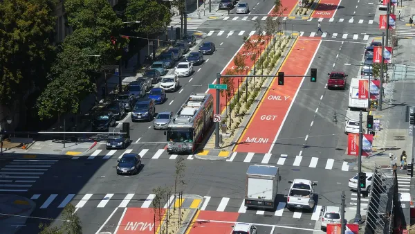 Aerial view of red center bus rapid transit lane with bus on Van Ness Avenue in San Francisco, California